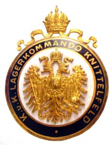 Службовий знак комендатури табору військовополонених в Кніттельфельді за каталоку аукціону Rauch за 2005 рік